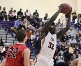 Lemoore's Daniel Charleston grabs a rebound in Friday's win over visiting Hanford, 66-58 as they remained atop the West Yosemite League standings.